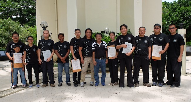 Attendees of the 2015 seminar and promotions: (L-R) Glenn Reyes with son Gavin, Ellen Joy Balgos, Alvin Penaflor, Master Nonoy Doncillo, Herend Canales, Master Buboy Ador, SGM Undo Caburnay, Joy Ortillo, Raymund Cabrera, GM Jun Igpit, Audie Gregorio, and Mannix Moya.