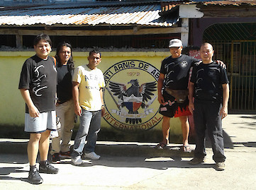 At the gate leading to Master Edgar's school and gym.