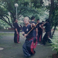 Master Cris in Espada y Daga cross-legged stance, Quezon Memorial Circle.