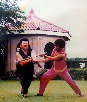 SGM Undo Caburnay demonstrating an espada y daga technique on GM Cris Ampit (circa 1970s, Cebu, Philippines).