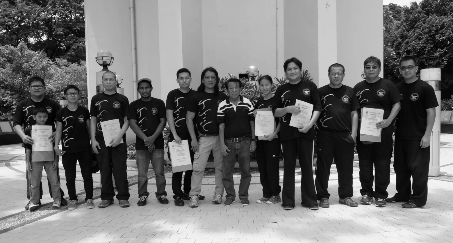 Attendees of the 2015 seminar and promotions: (L-R) Glenn Reyes with son Gavin, Ellen Joy Balgos, Alvin Penaflor, Master Nonoy Doncillo, Herend Canales, Master Buboy Ador, SGM Undo Caburnay, Joy Ortillo, Raymund Cabrera, GM Jun Igpit, Audie Gregorio, and Mannix Moya.