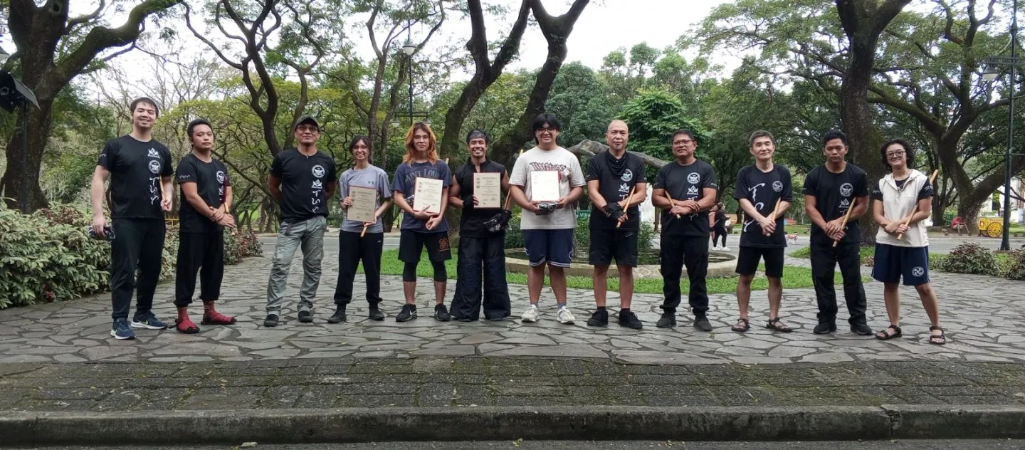 December 2024 promoted members: Jerico Lagdaméo (2nd from L), (holding their certificates, L-R) Kon Caturay, Ronan Koda Padilla, Josh Balburias, and Joaquin Saavedra. With officers, instructors, and members of the club.