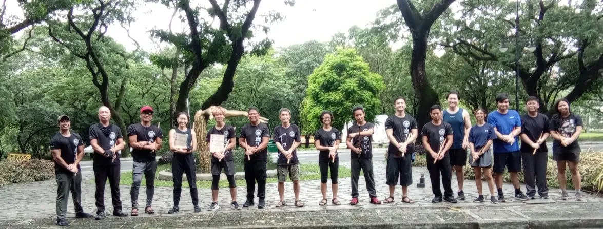 Regina De Vera (4th from L) and Ronan Koda Padilla (5th from L) holding their certicates of promotion, with members of Lapunti Karilyon who attended the June 2025 rank promotion ceremony.