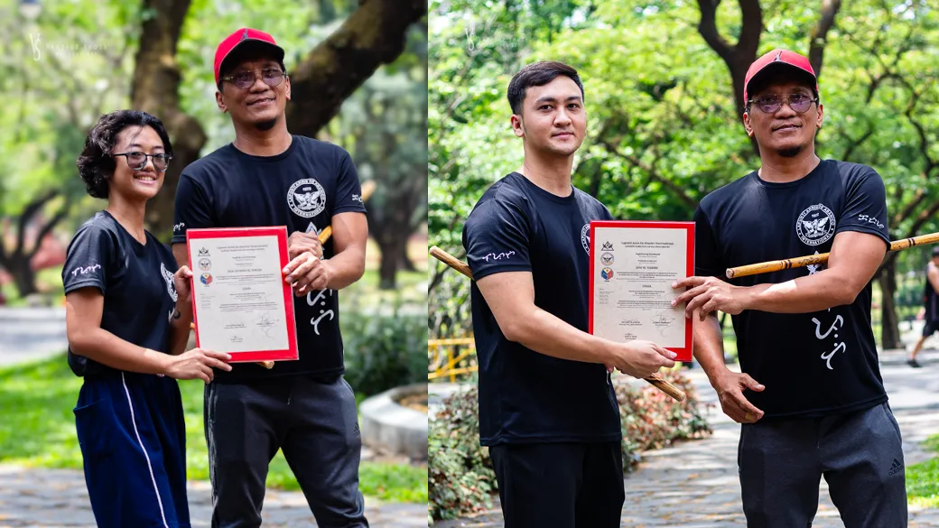 Ace Yorobe (L) and Josf Yorobe (R) receiving their certificate of promotion from Senior Master Buboy Ador.