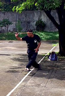 GM Jun Igpit performing a cross-legged stance.